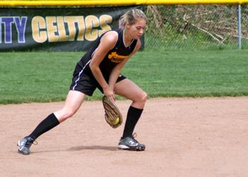 female softball player in defensive stance