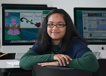 student with graphic design on screen