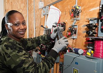 student working on electrical installation