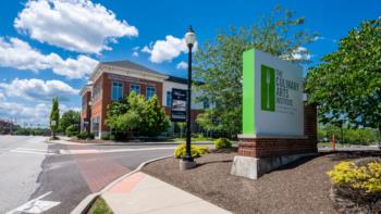 campus sign at the entrance with clear skies