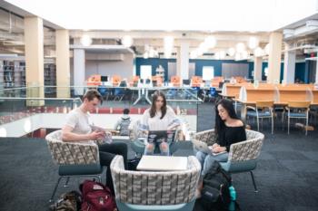 students studying together in a library