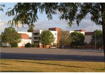 view of campus buildings and lawn