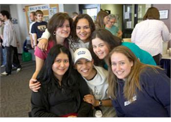 group of smiling students indoors