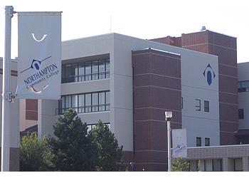 campus building with institution flags