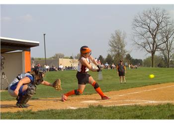 softball pitcher in mid-throw