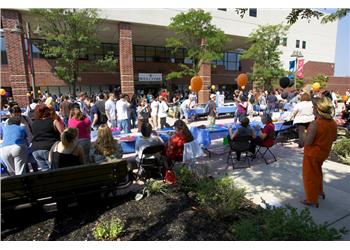 crowded outdoor event with tents