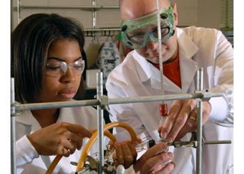 students and instructor working in a lab