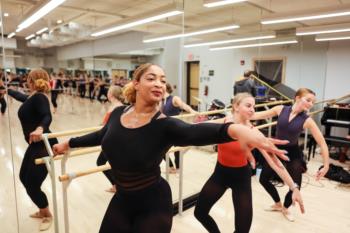 dancers practicing at ballet barre