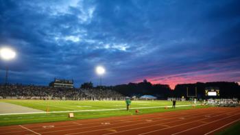 stadium with purple sky at dusk