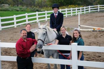 equestrian team with horse and instructor