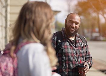 man smiling at someone off-camera