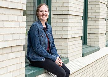 woman sitting and laughing on steps