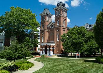 historical building with red bricks and clock tower